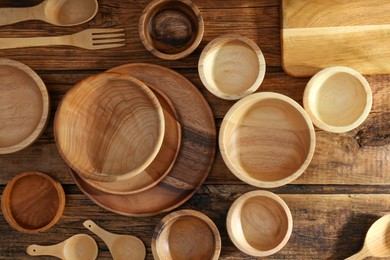 Many different wooden dishware and utensils on table, flat lay