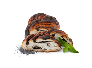 Photo of Cut poppy seed roll and mint leaves isolated on white. Tasty cake