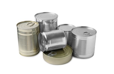 Photo of Many closed tin cans isolated on white