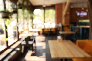 Photo of Blurred view of cafe interior with bokeh effect