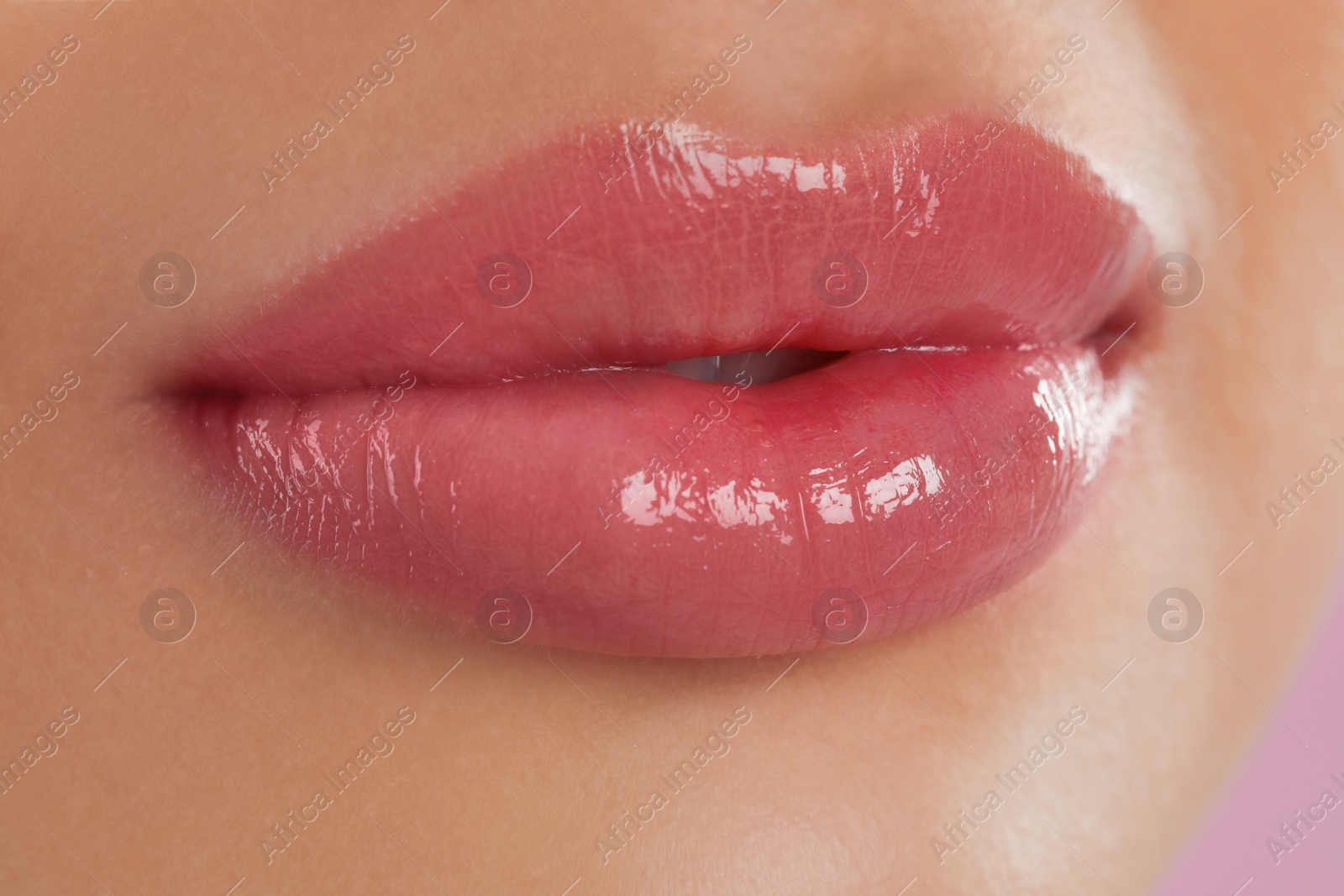 Photo of Young woman with beautiful full lips, closeup
