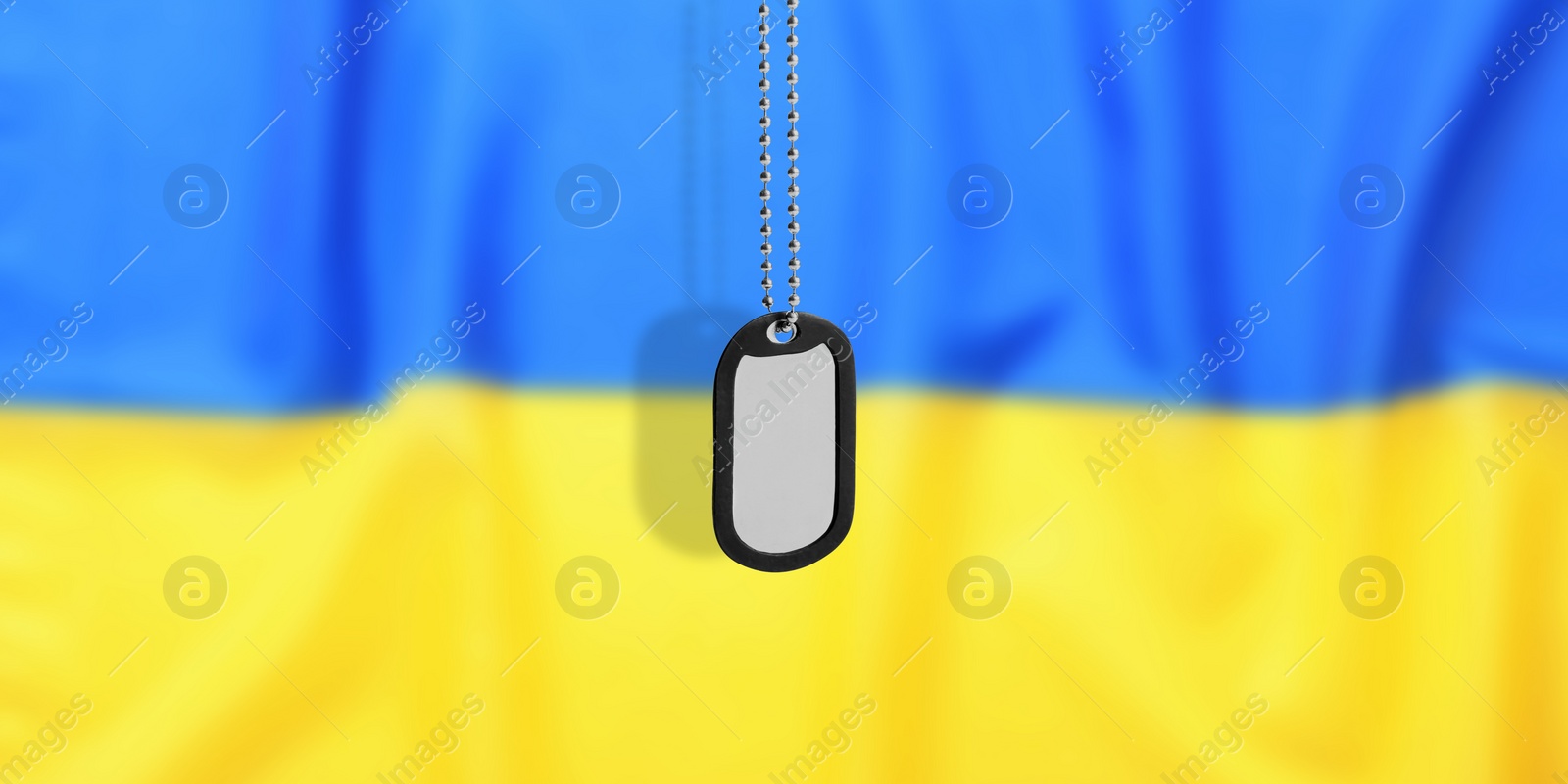 Image of Military ID tag and Ukrainian flag on background. Banner design