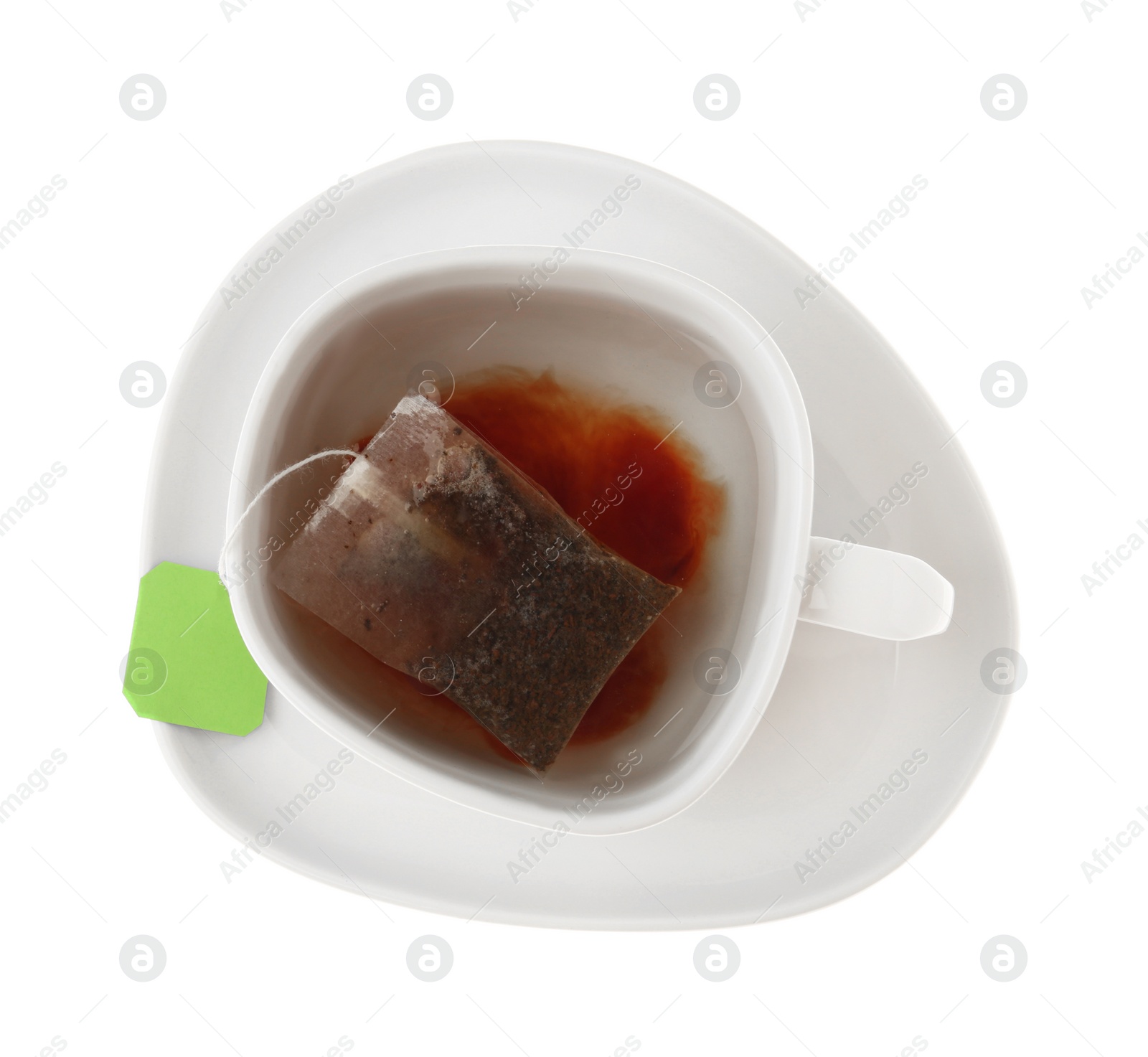 Photo of Tea bag in cup of hot water isolated on white, top view