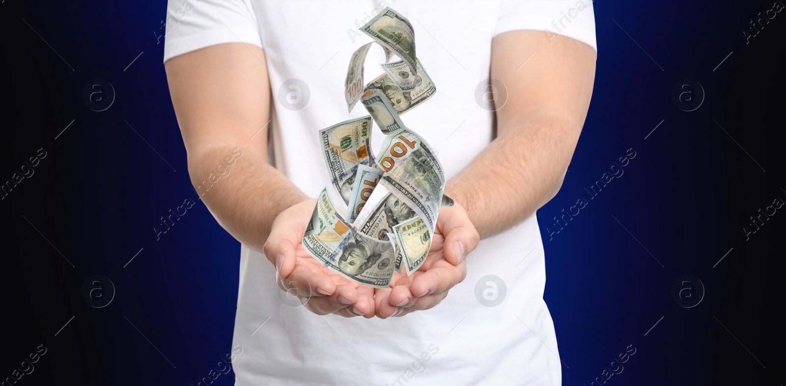 Image of Man with money on dark background, closeup. Currency exchange