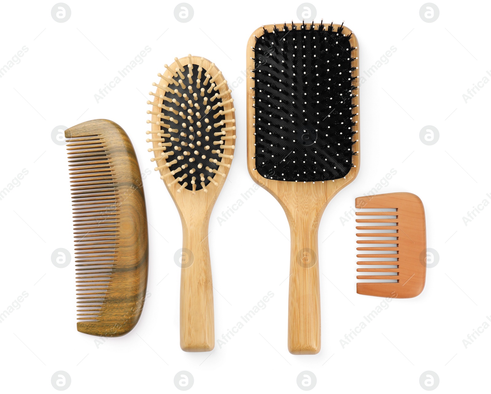 Photo of Set of hair brushes and combs isolated on white, top view