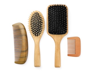 Set of hair brushes and combs isolated on white, top view