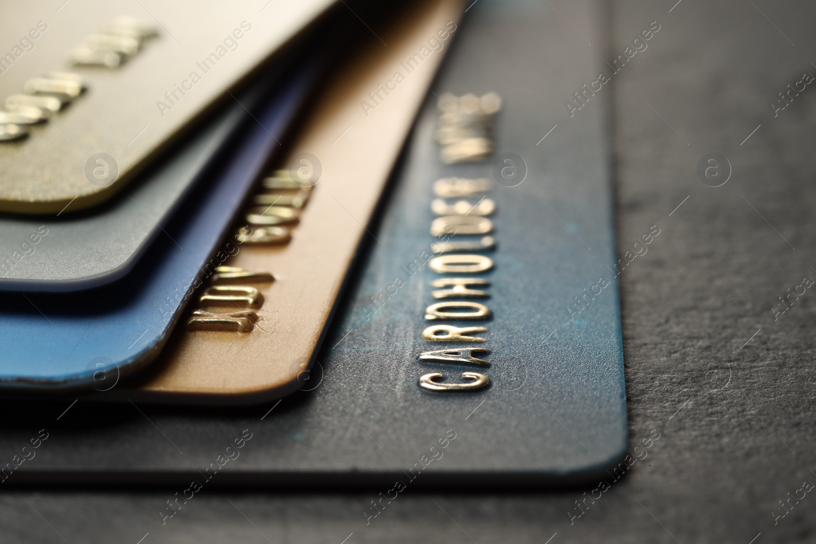 Photo of Many credit cards on gray table, closeup