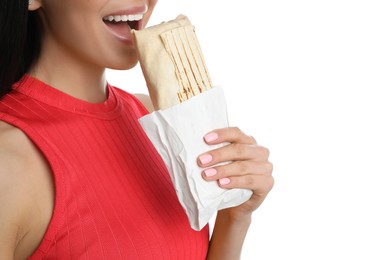Young woman eating delicious shawarma on white background, closeup