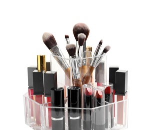 Photo of Lipstick holder with different makeup products on white background, closeup