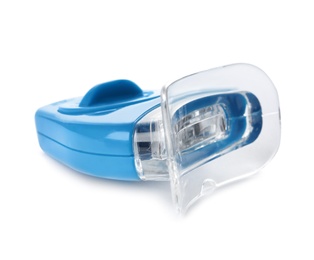 Photo of Tooth whitening device on white background. Dental care