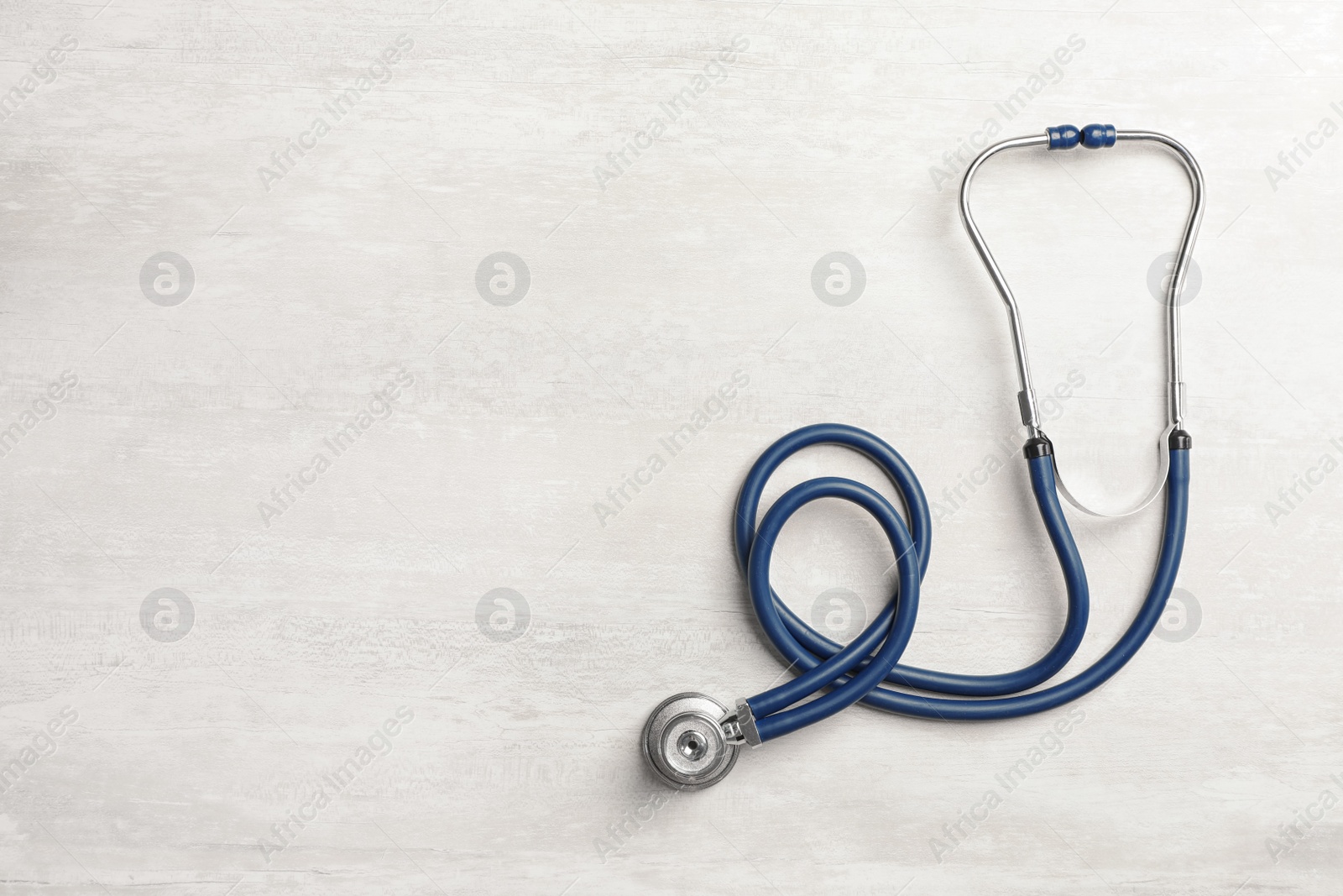 Photo of Stethoscope and space for text on light background. Medical object