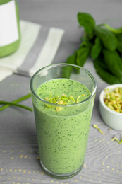 Photo of Green buckwheat smoothie on light grey wooden table