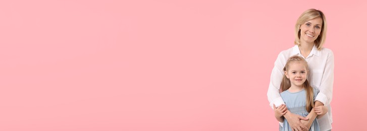Image of Happy mother and daughter on light pink background, space for text. Banner design