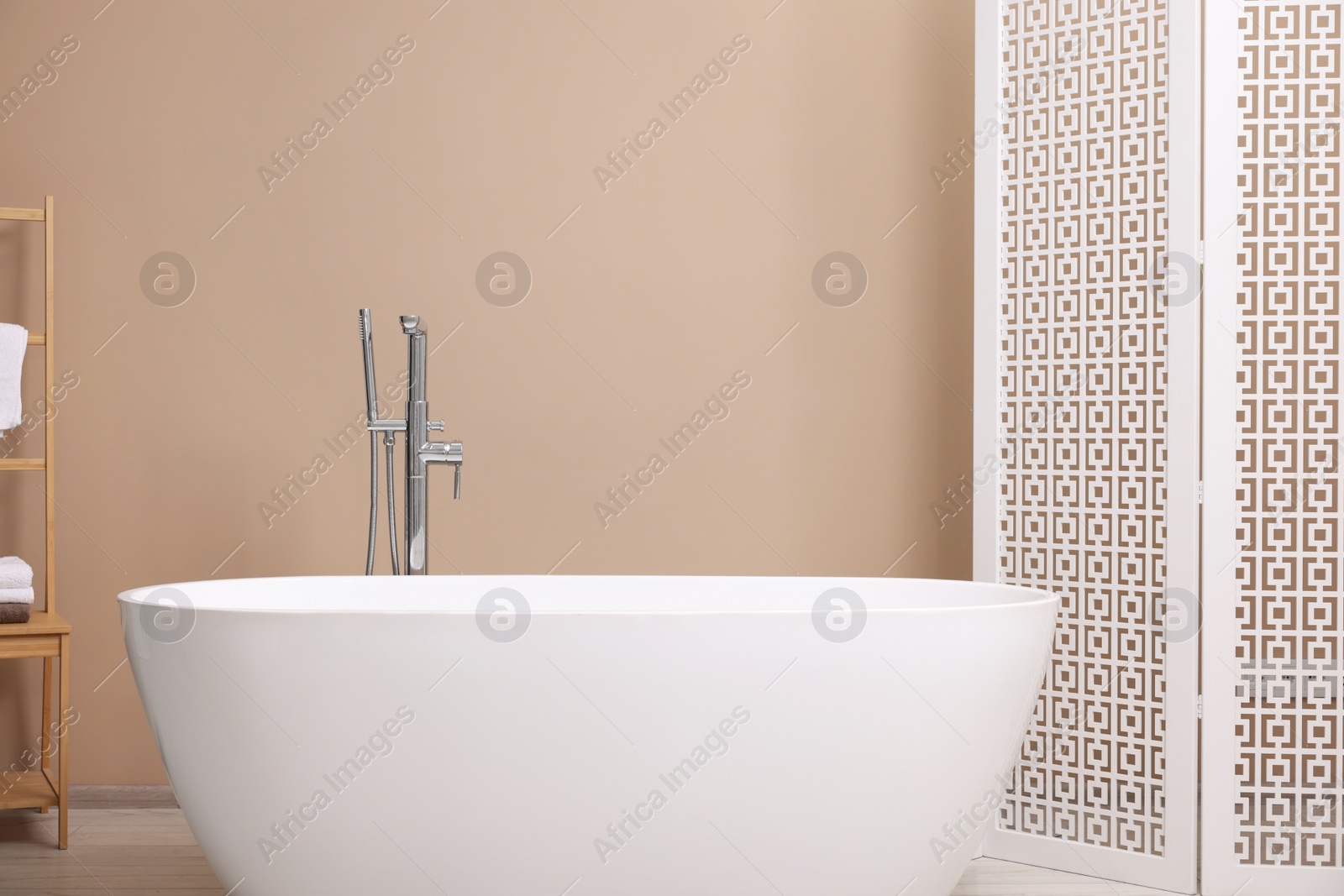 Photo of White ceramic tub in bathroom. Interior design