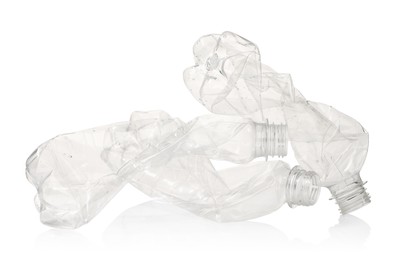 Crumpled disposable plastic bottles isolated on white