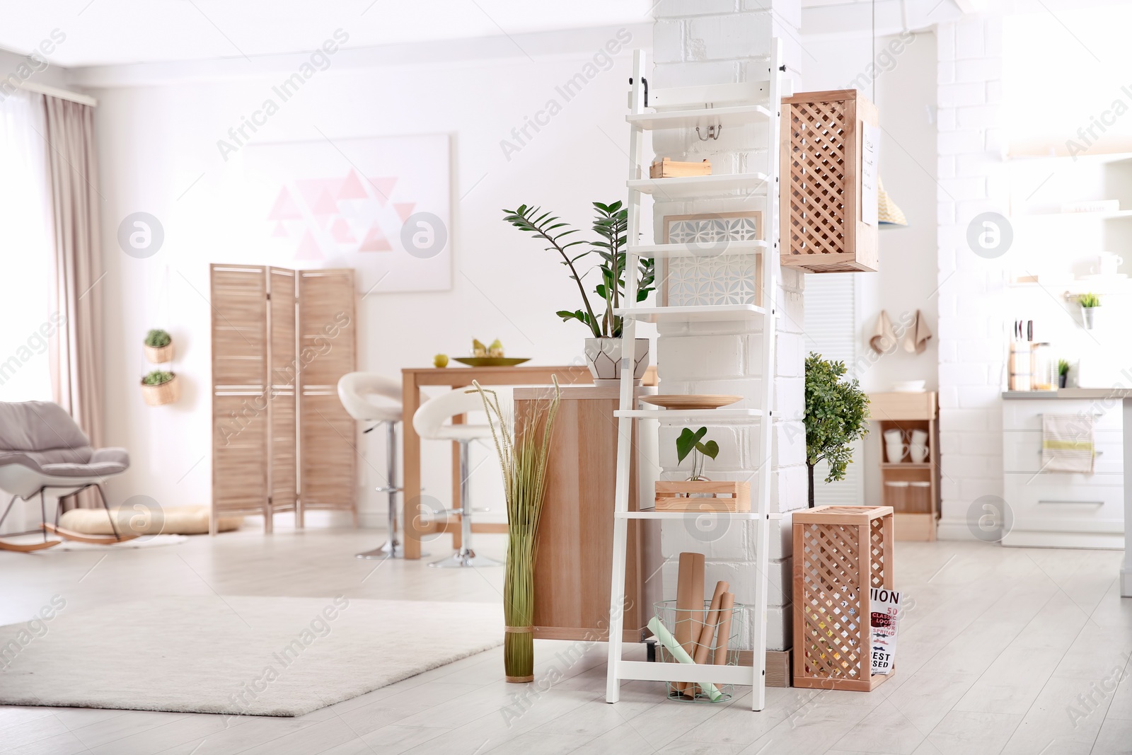 Photo of Modern eco style interior with wooden crates and shelves