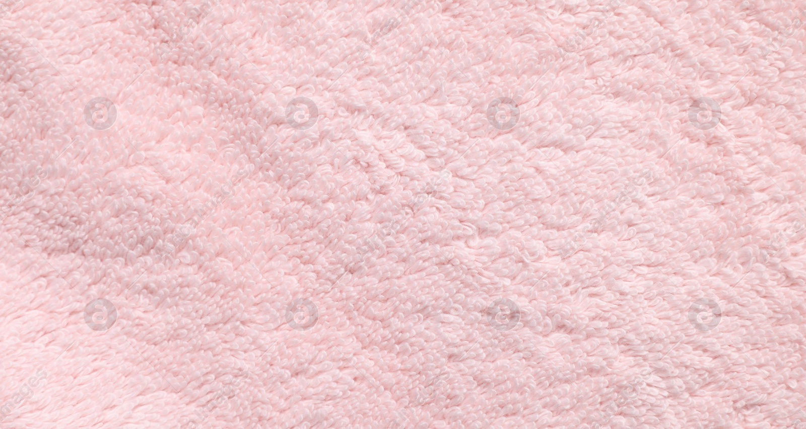 Photo of Texture of soft pink fabric as background, top view