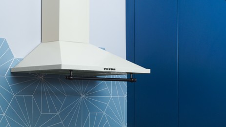Photo of Modern white electric exhaust hood in kitchen