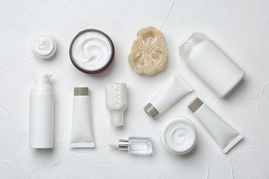 Photo of Flat lay composition with body care products on white background