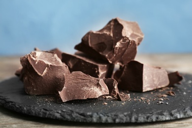 Delicious dark chocolate on slate plate, closeup