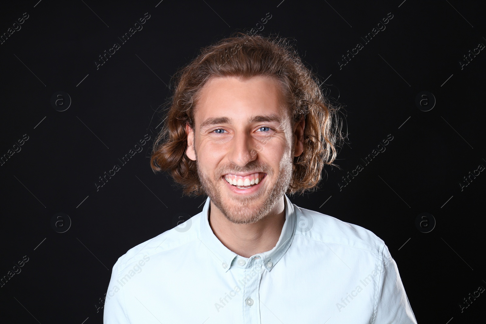 Photo of Portrait of handsome man on black background