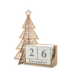Photo of Wooden block calendar with date 26th of December near decorative Christmas tree on white background. Boxing day