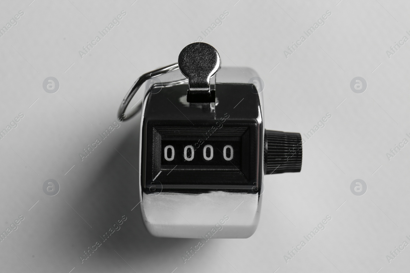 Photo of Modern timer on light grey background, top view