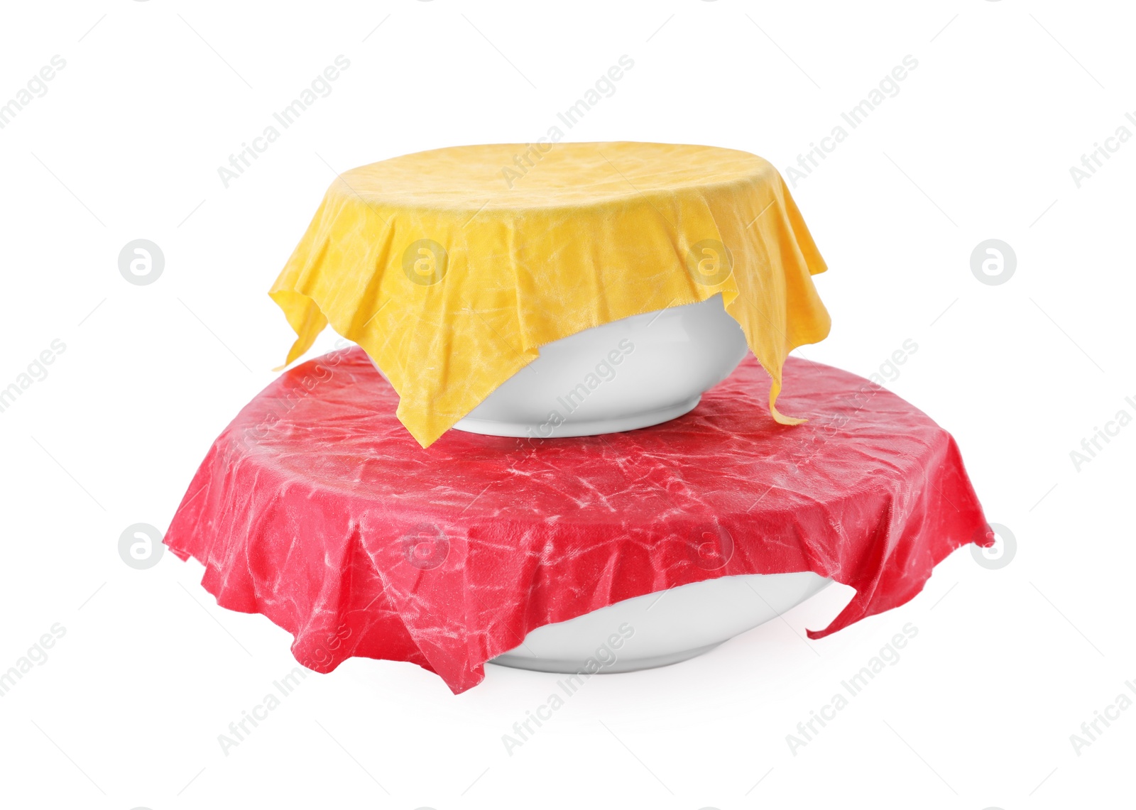 Photo of Bowls covered with beeswax food wraps isolated on white