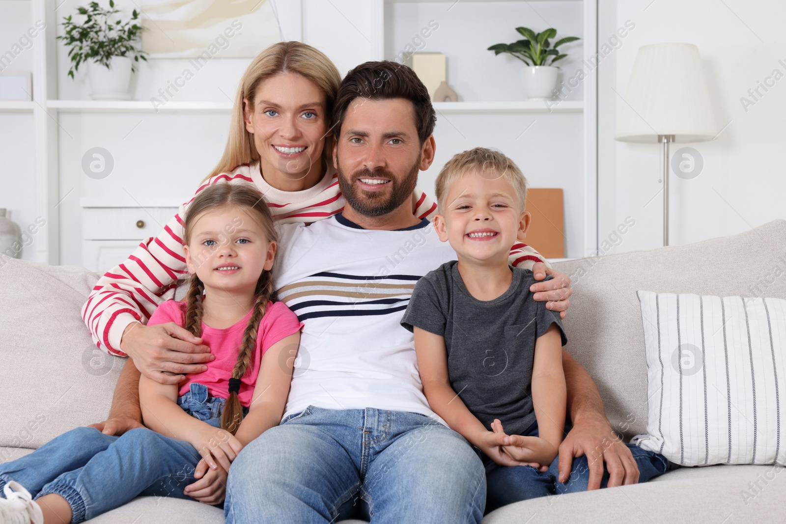 Photo of Portrait of happy family with children on sofa at home