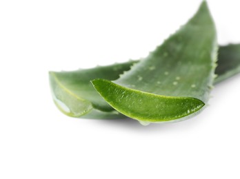 Photo of Green aloe vera leaves isolated on white, closeup