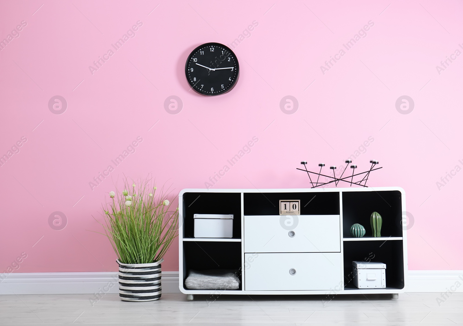 Photo of Elegant room interior with stylish shelving unit