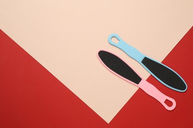 Photo of Foot files on color background, flat lay with space for text. Pedicure tools