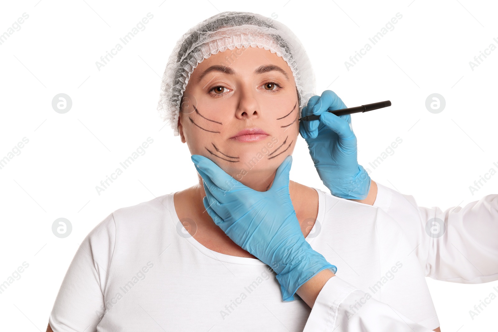 Photo of Doctor drawing marks on woman's face for cosmetic surgery operation against white background. Double chin problem