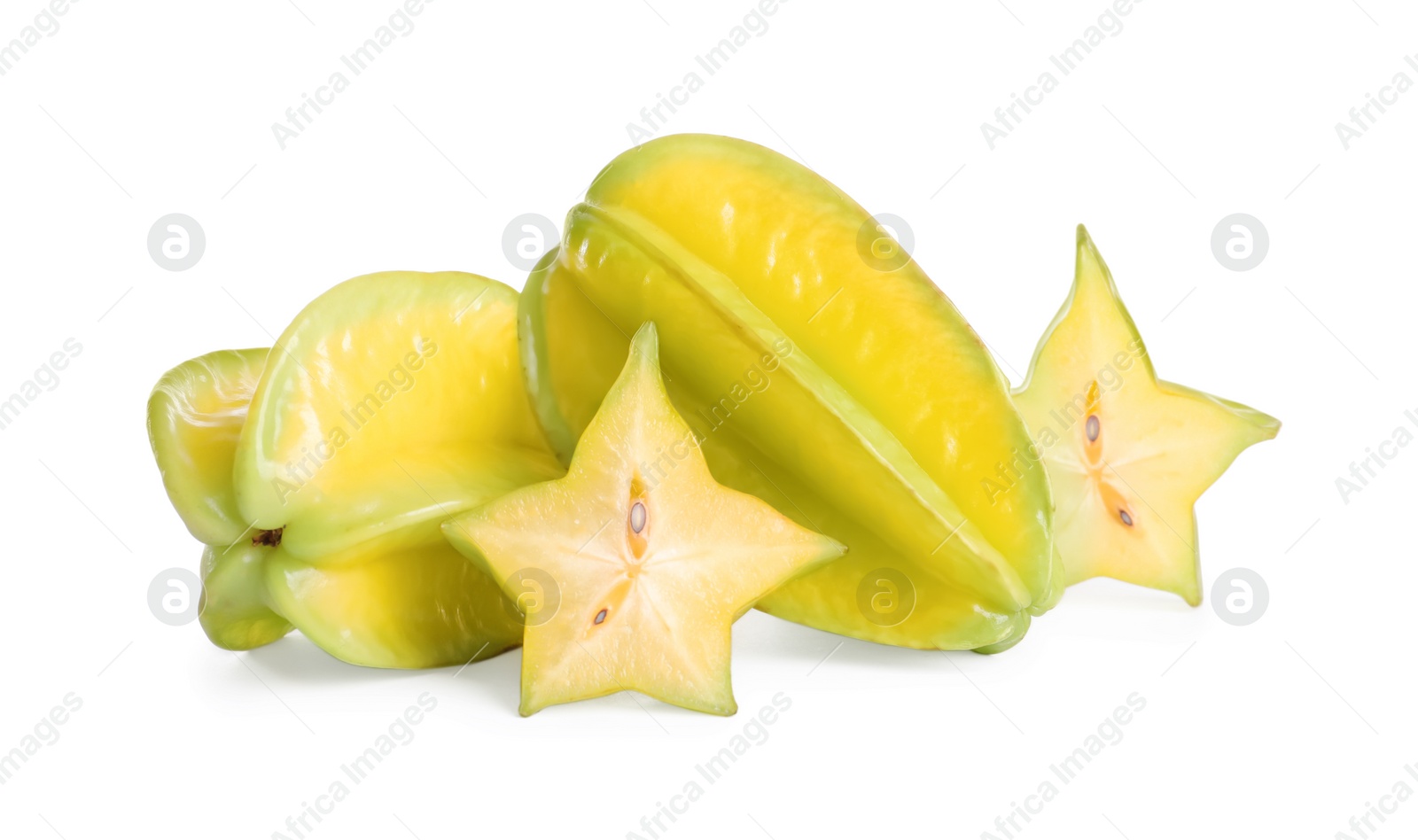 Photo of Cut and whole carambolas on white background