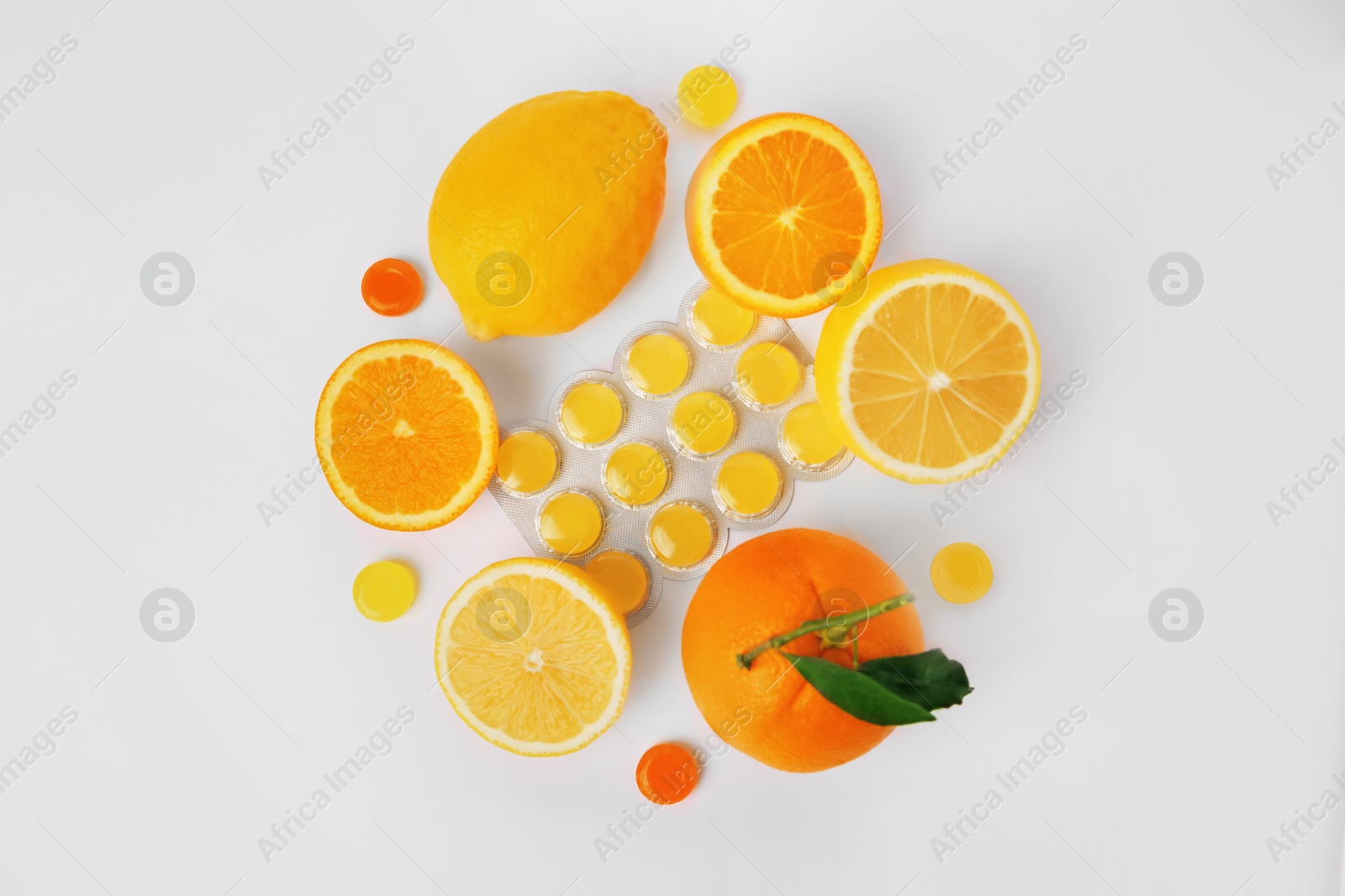 Photo of Flat lay composition with cough drops and fresh fruits on white background