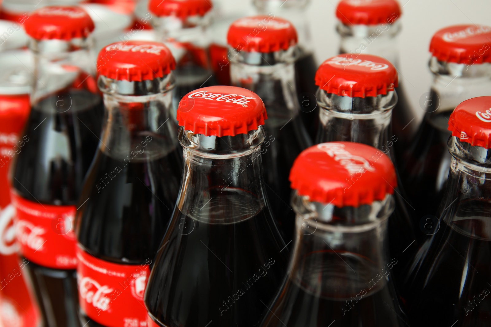 Photo of MYKOLAIV, UKRAINE - NOVEMBER 14, 2018: Many bottles of Coca-Cola on display in store