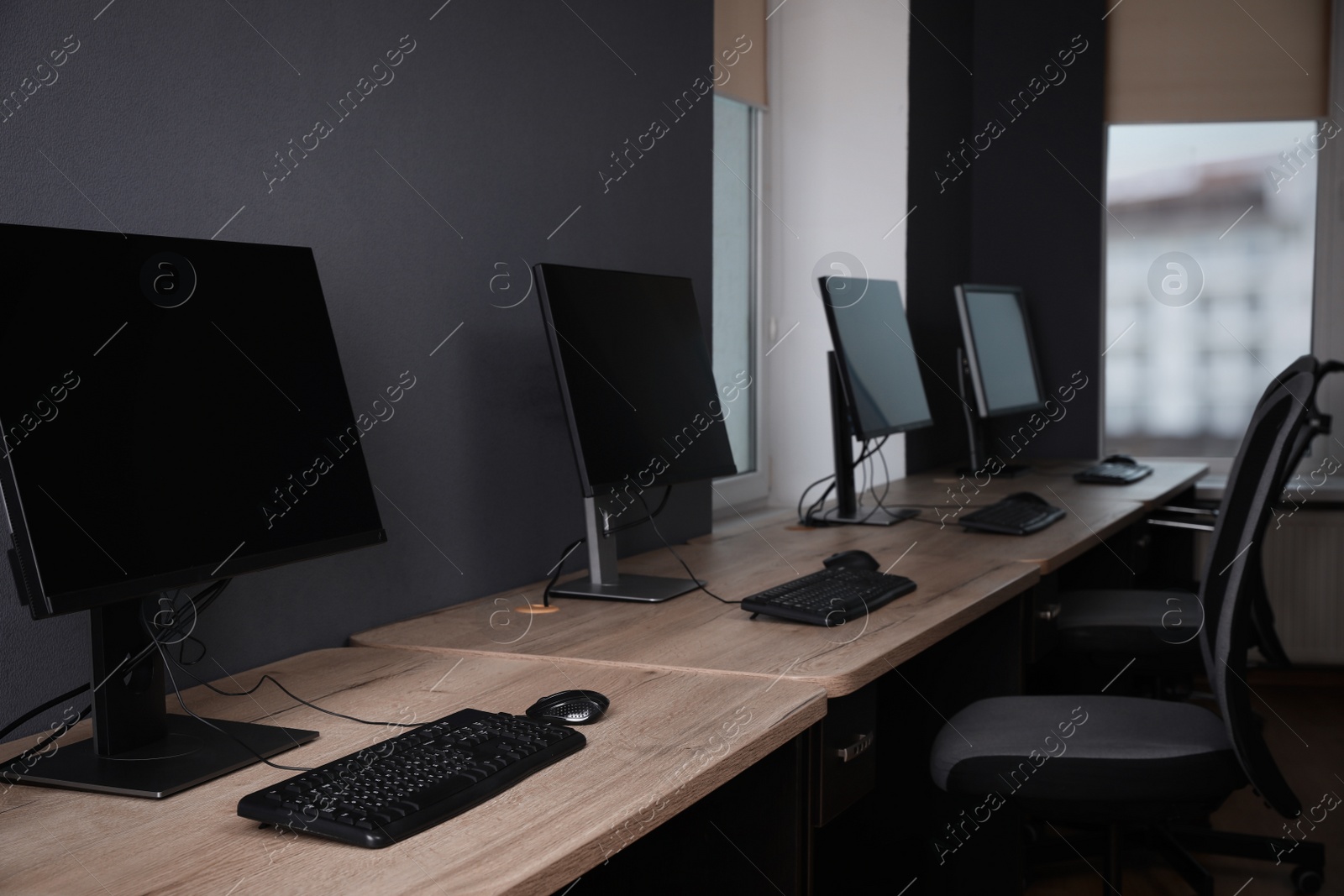 Photo of Many modern computers in open space office