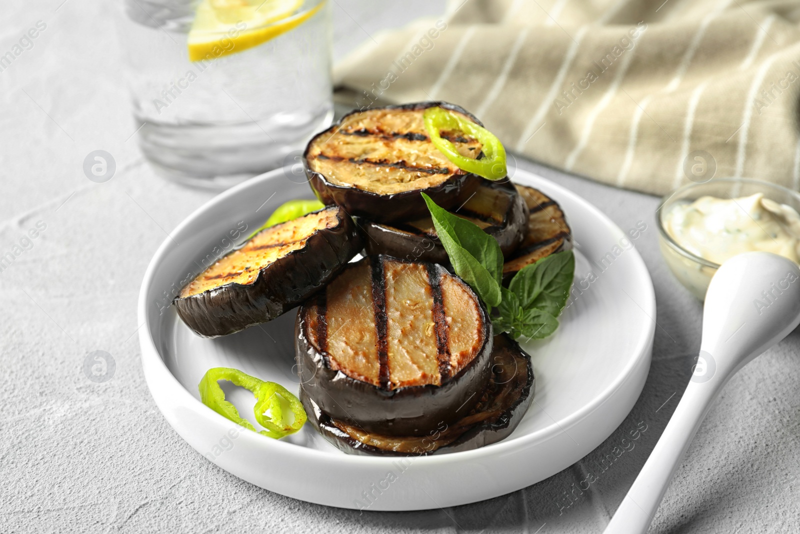 Photo of Plate with fried eggplant slices on table