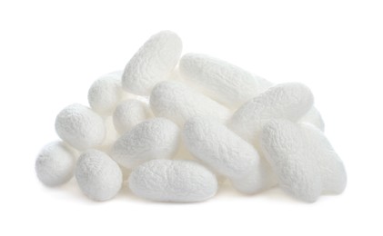 Photo of Pile of natural silkworm cocoons on white background