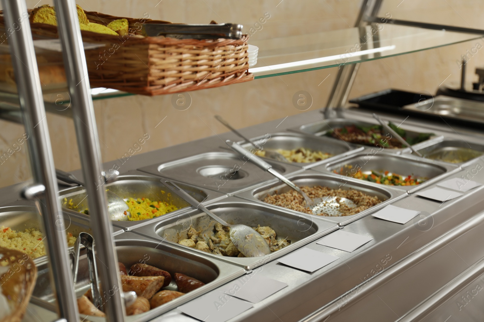 Photo of Containers with tasty food in school canteen