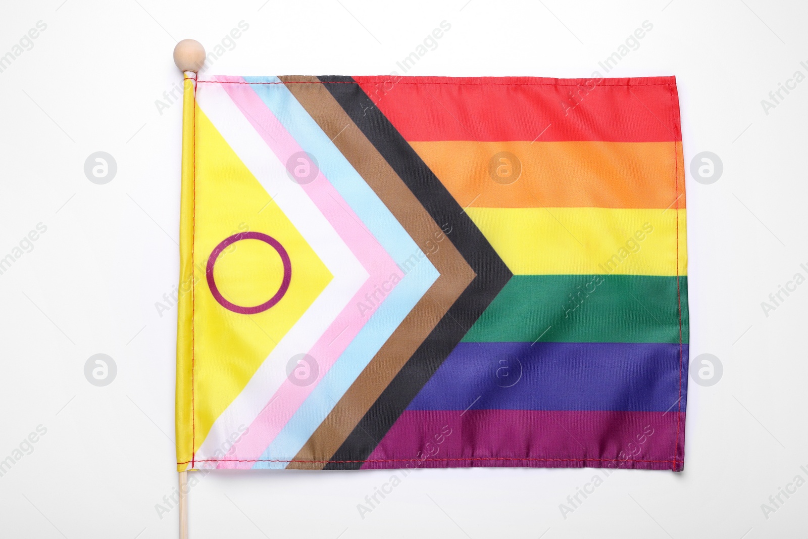 Photo of Bright progress flag on white background. LGBT pride