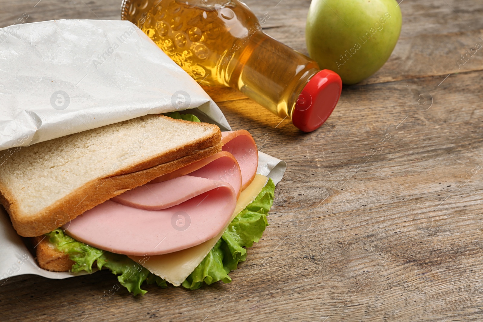 Photo of Healthy food for school lunch on wooden table, closeup view. Space for text