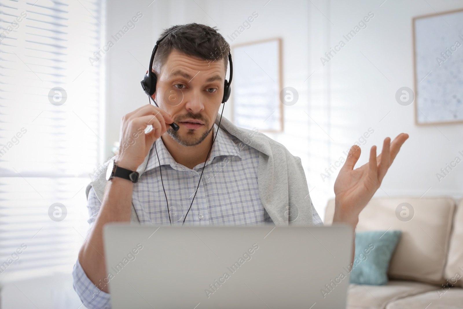 Photo of Teacher conducting online lesson at home during COVID-19 quarantine