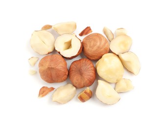 Heap of tasty hazelnuts on white background, top view