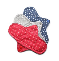 Many cloth menstrual pads on white background, top view. Reusable female hygiene product