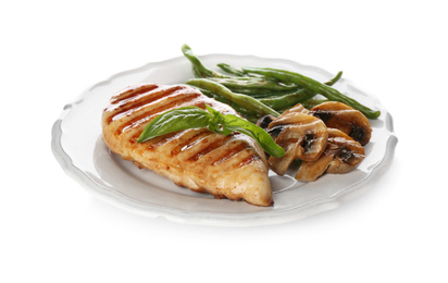 Photo of Tasty grilled chicken fillet with green beans, mushrooms and basil isolated on white