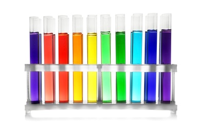 Photo of Rack with test tubes of color liquid isolated on white. Solution chemistry