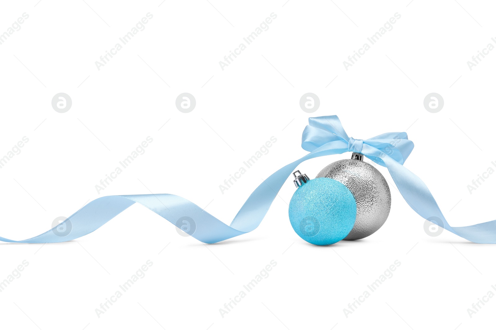 Photo of Beautiful Christmas balls and ribbon isolated on white