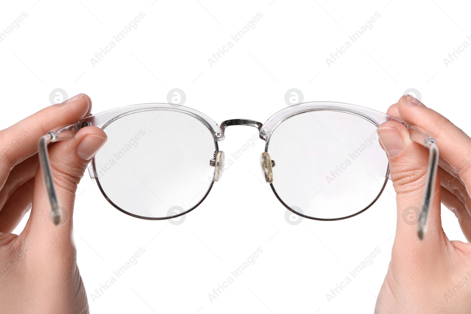 Photo of Woman holding stylish glasses with transparent frame on white background, closeup