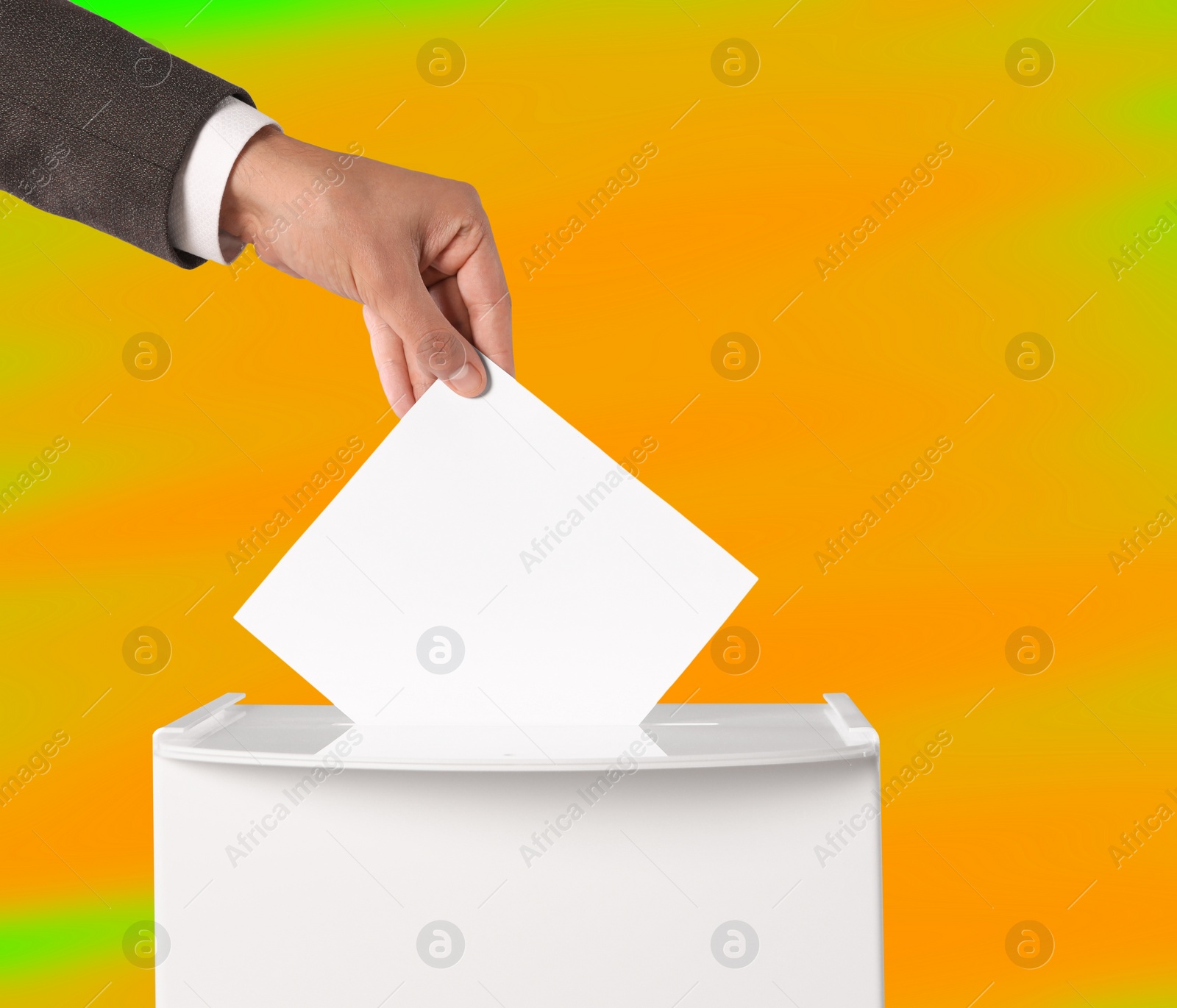 Image of Man putting his vote into ballot box on color background, closeup